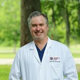 Dr. Justin M. Tenney